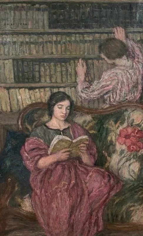 In biblioteca, donna che legge